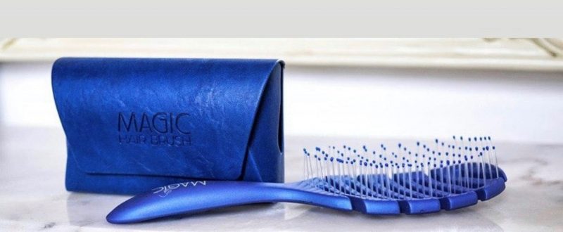 Magic Hair Brush Blue with blue case on table